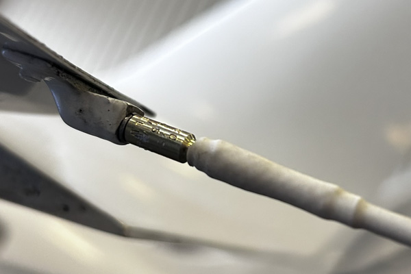 Corroded aircraft static wick mounting base showing evidence of electrical arcing