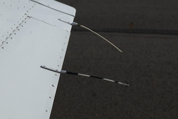 Cracked and eroded protective coating on an aircraft static wick exposing conductive material